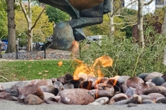Eternal Flame For 9-11 Victims With Sphere Sculpture Behind It