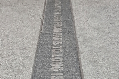 Passerby Crosses Over Granite Commemorative Paver-Canyon Of Heroes, Financial District, NYC